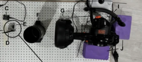 Labeled diagram of the wind tunnel rig built to test passive vortex propulsion